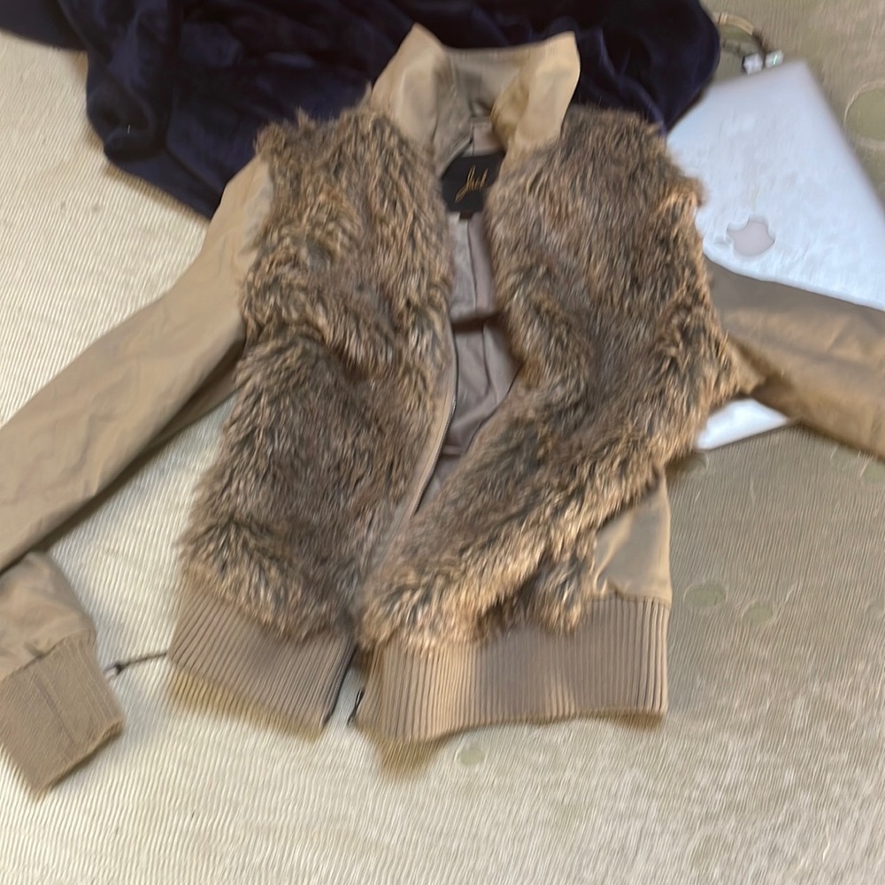 This jacket is faux fur and 100 %polyester but it is such a beautiful Jacket.